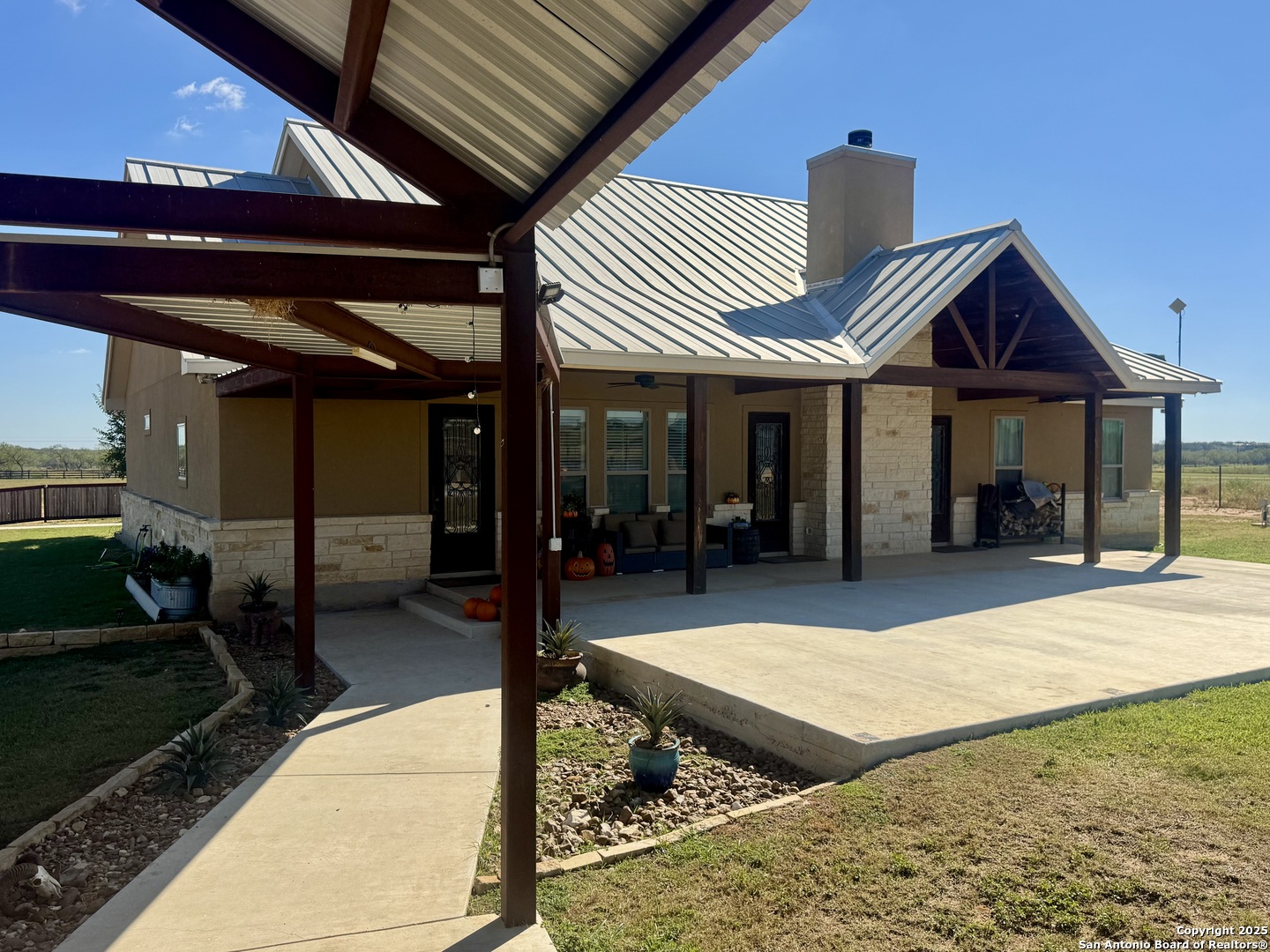 16489 Farm To Market Road 472 Devine, TX 78016 - Photo 4 of 31 a view of outdoor space and porch