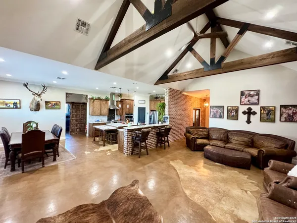 a living room with furniture and a piano