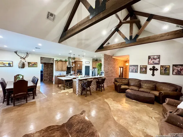 a living room with furniture and a piano