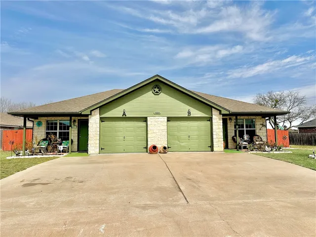 a view of a house with a garage