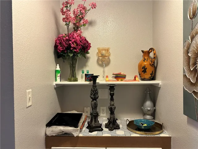 a view of living room with furniture and flowers