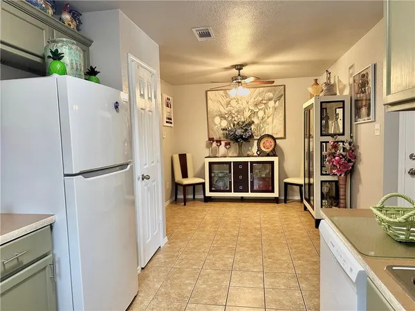 a kitchen with stainless steel appliances a refrigerator and a sink