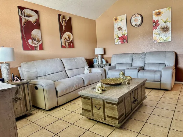 a living room with furniture and a table