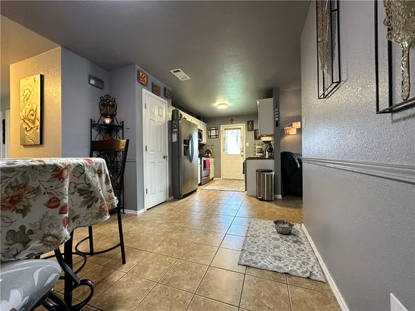 a living room with furniture and a rug