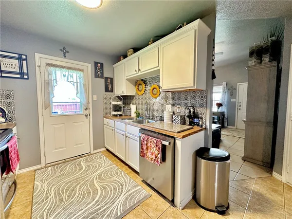 a kitchen with a stove and a refrigerator