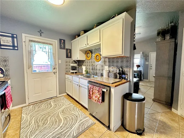 a kitchen with a stove and a refrigerator