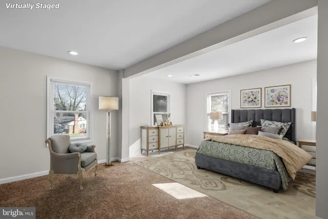 a bedroom with a bed and a couch