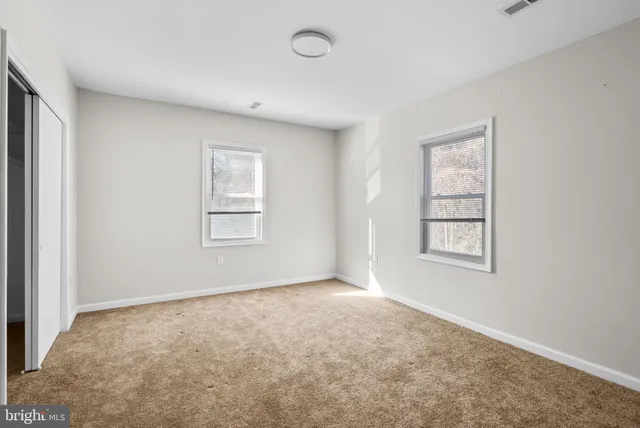 an empty room with windows