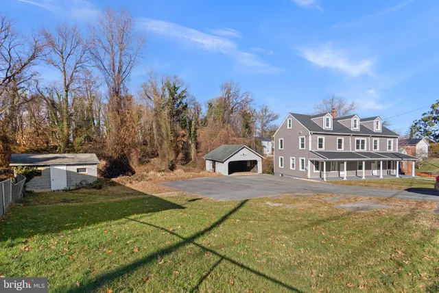 a view of a big yard with large tree