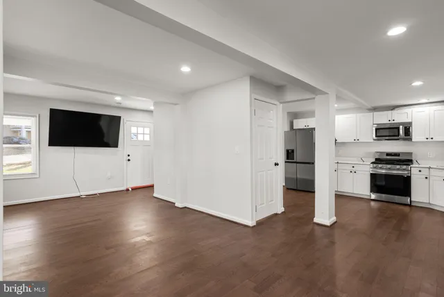 a view of a kitchen with a sink oven and window