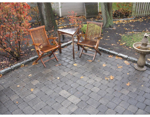 19 Waldorf Road Newton, MA 02461 - Photo 15 of 18 a view of a chairs and table in backyard