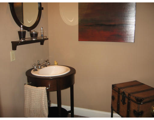 19 Waldorf Road Newton, MA 02461 - Photo 17 of 18 a bathroom with a sink and a mirror