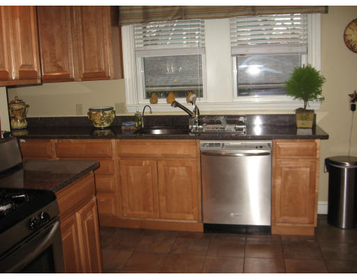 19 Waldorf Road Newton, MA 02461 - Photo 2 of 18 a kitchen with stainless steel appliances granite countertop a sink stove and cabinets
