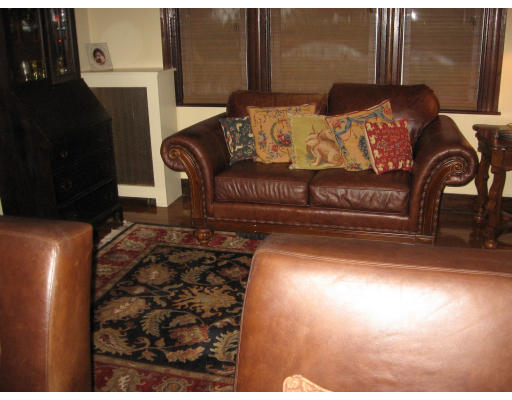 19 Waldorf Road Newton, MA 02461 - Photo 8 of 18 a living room with furniture and a fireplace