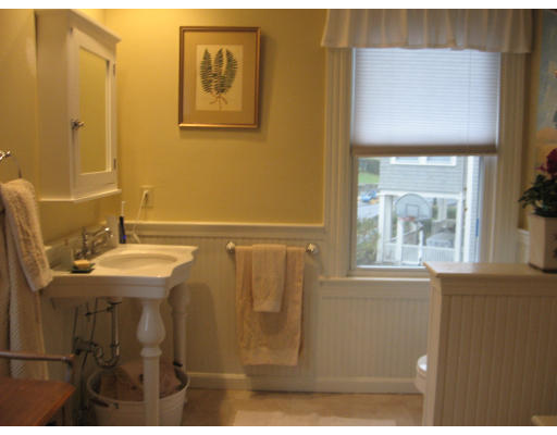 19 Waldorf Road Newton, MA 02461 - Photo 10 of 18 a bathroom with a sink a mirror and a window