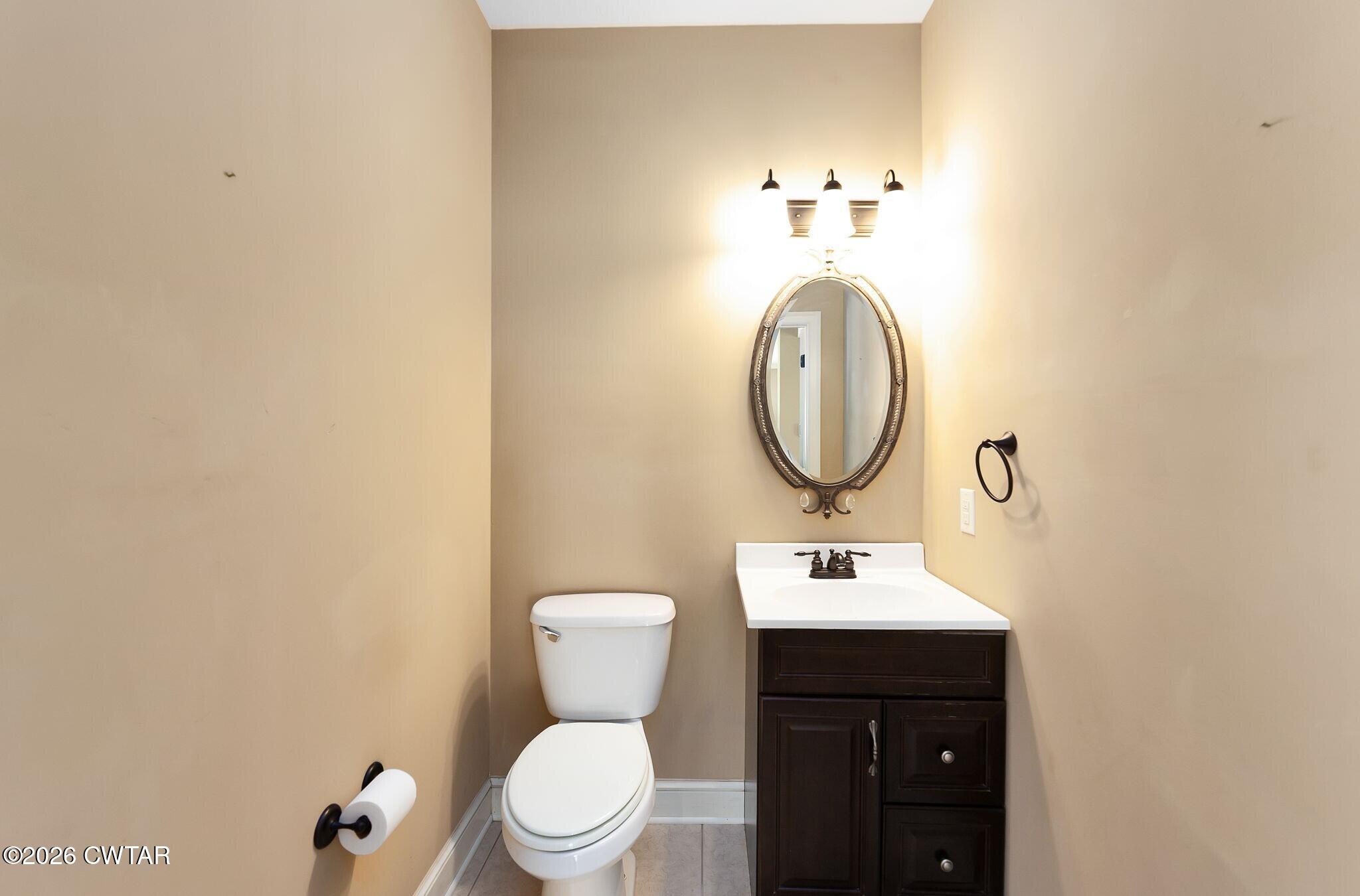 4080 Beech Bluff Road Beech Bluff, TN 38313 - Photo 36 of 41 a bathroom with a toilet sink and mirror