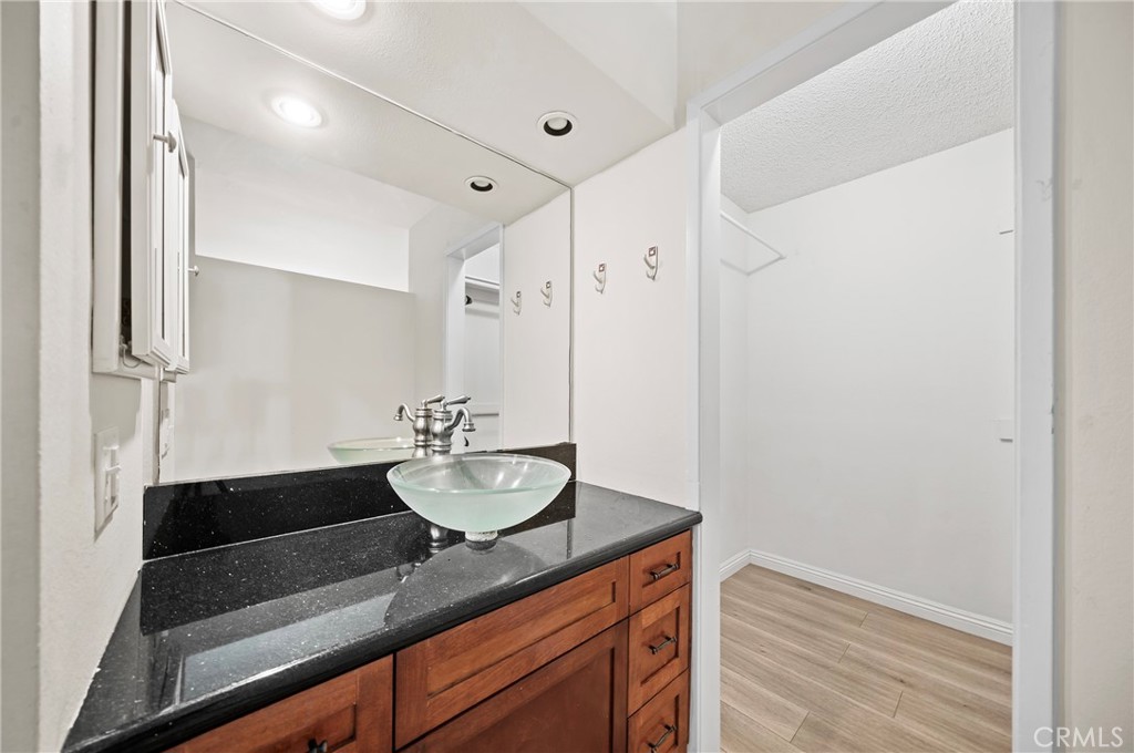 63 Streamwood Irvine, CA 92620 - Photo 18 of 25 a bathroom with a sink a double vanity and a mirror