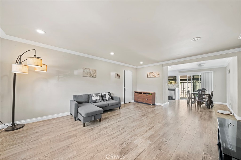 63 Streamwood Irvine, CA 92620 - Photo 6 of 25 a living room with furniture and wooden floor