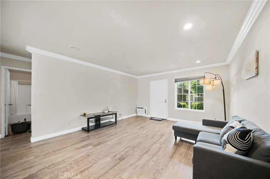 63 Streamwood Irvine, CA 92620 - Photo 7 of 25 a living room with furniture and a window
