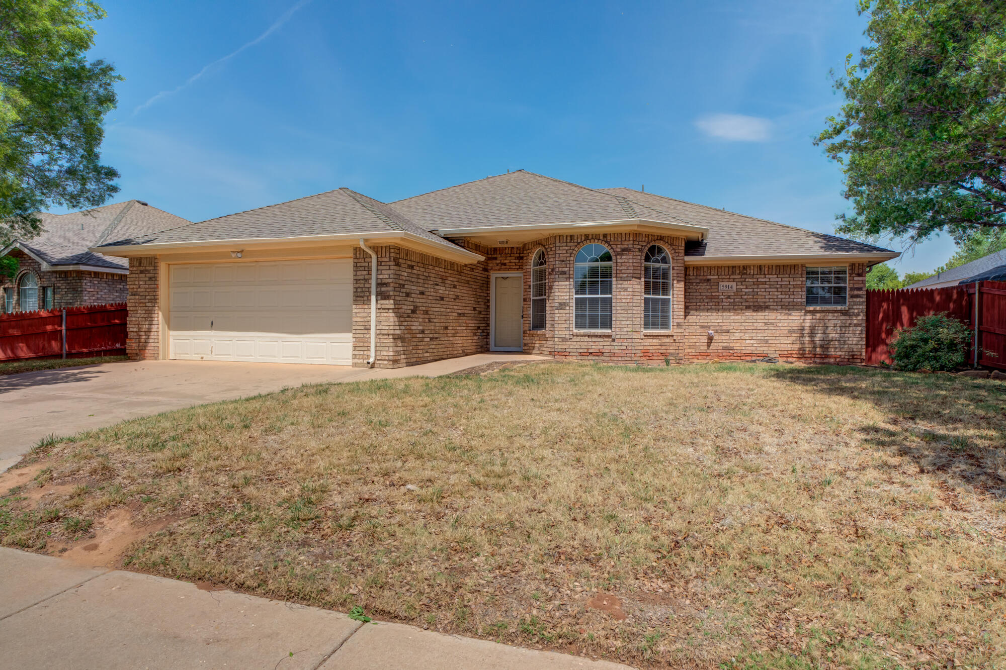 5914 88th Place Lubbock, TX 79424 - Photo 2 of 39 front view of a house with a yard