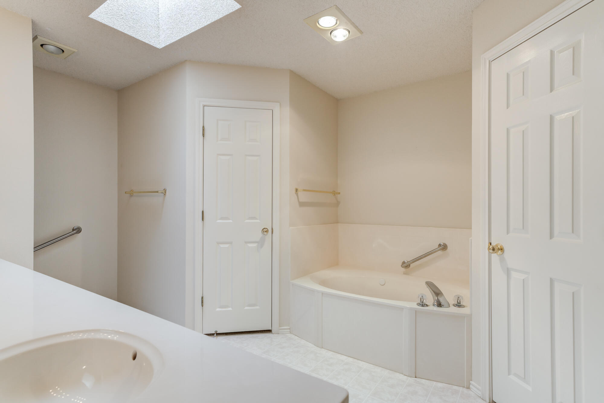 5914 88th Place Lubbock, TX 79424 - Photo 21 of 39 a bathroom with a bathtub and shower