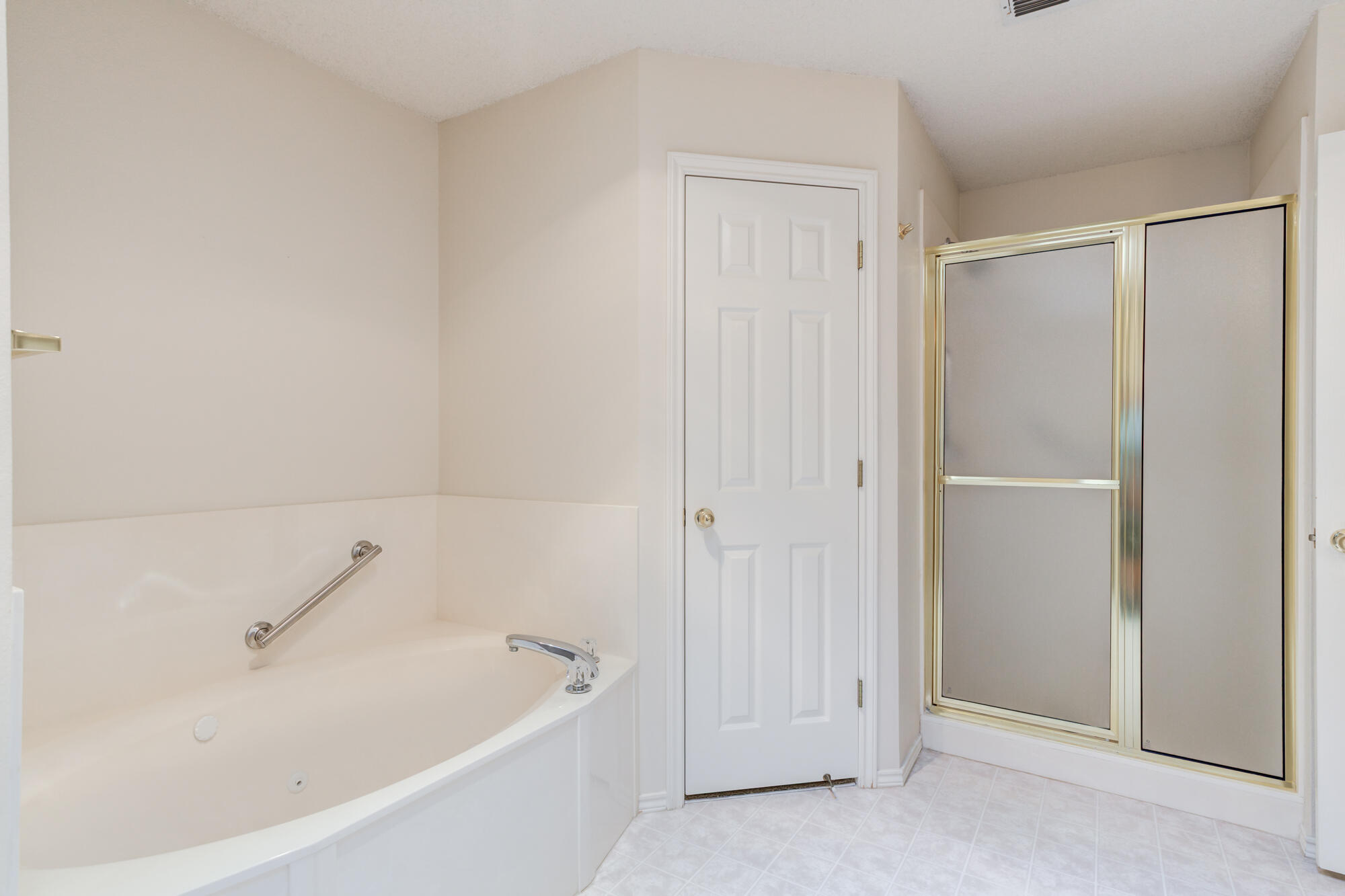 5914 88th Place Lubbock, TX 79424 - Photo 23 of 39 a white bath tub sitting in a bathroom