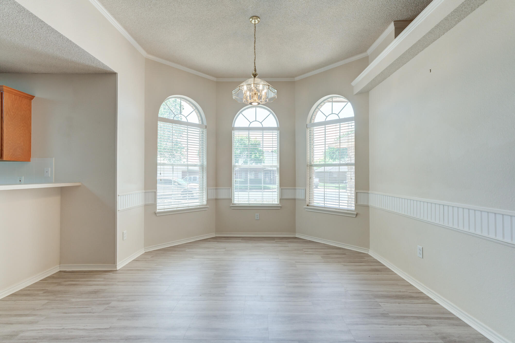 5914 88th Place Lubbock, TX 79424 - Photo 4 of 39 a view of an empty room with wooden floor and window
