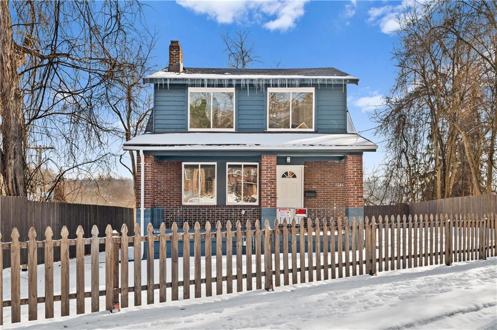 1486 Mill Street Pittsburgh, PA 15221 - Photo 1 of 25 a front view of a house with a fence