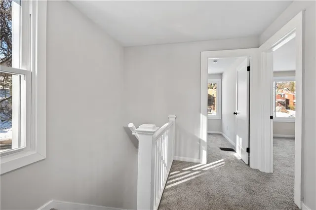 a view of a room with wooden wall and shower
