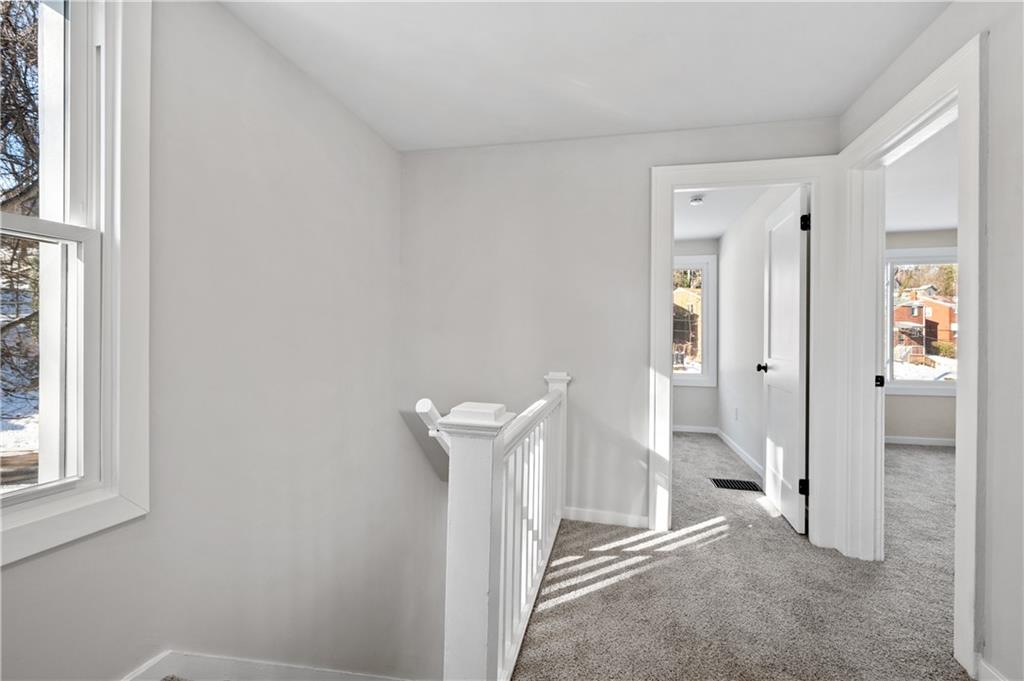 1486 Mill Street Pittsburgh, PA 15221 - Photo 14 of 25 a view of a room with wooden wall and shower