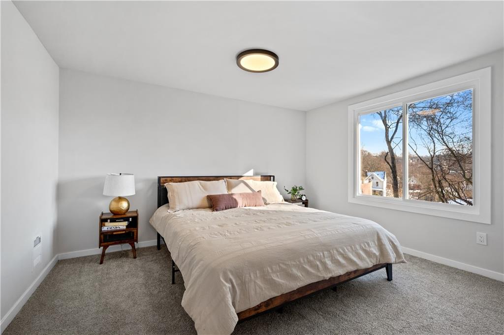 1486 Mill Street Pittsburgh, PA 15221 - Photo 16 of 25 a bedroom with a bed and a window