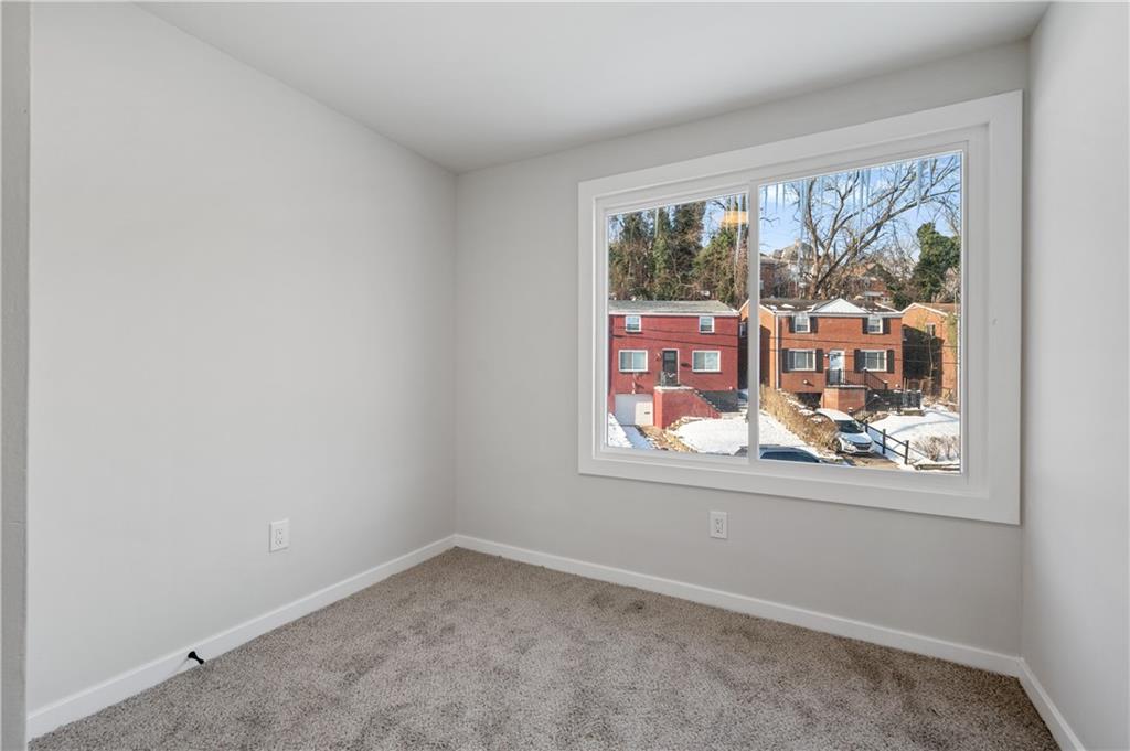 1486 Mill Street Pittsburgh, PA 15221 - Photo 17 of 25 an empty room with a window