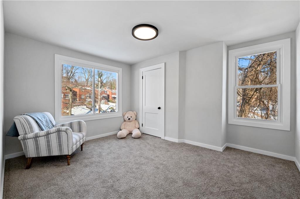 1486 Mill Street Pittsburgh, PA 15221 - Photo 19 of 25 a living room with furniture and a window