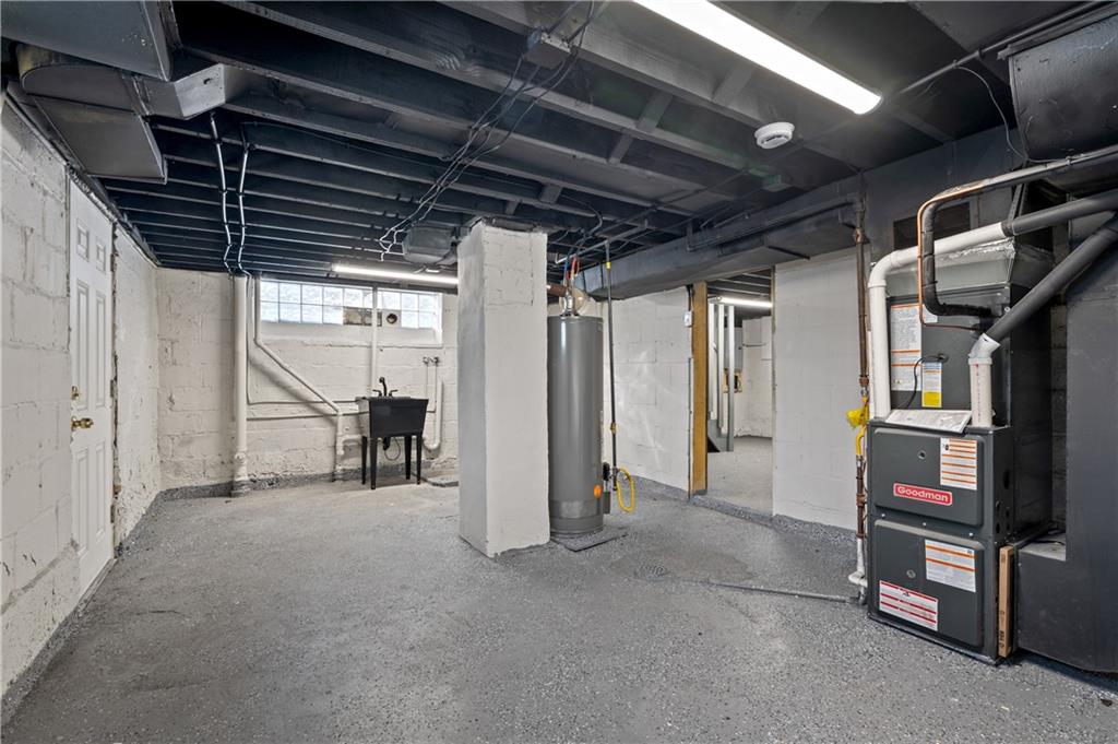 1486 Mill Street Pittsburgh, PA 15221 - Photo 21 of 25 a view of an empty room with wooden floor