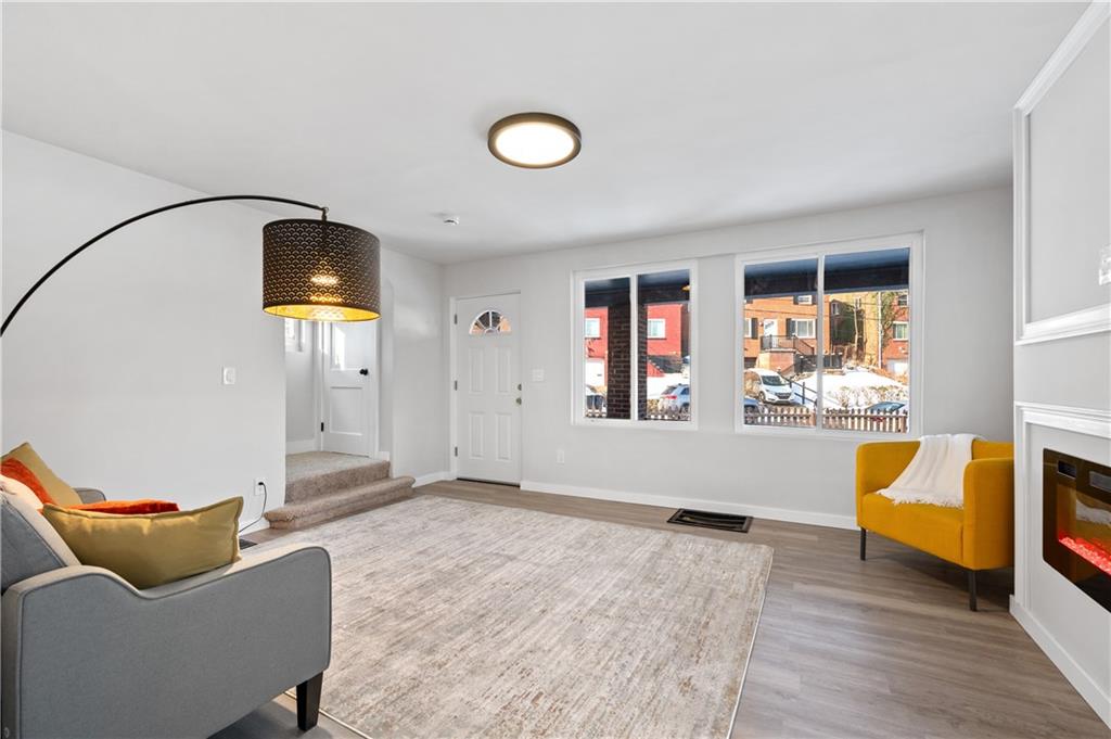 1486 Mill Street Pittsburgh, PA 15221 - Photo 6 of 25 a living room with furniture and a window