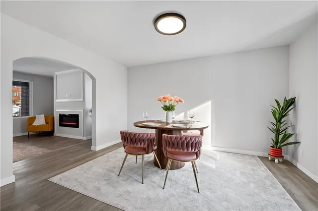 a view of a livingroom with furniture and a potted plant