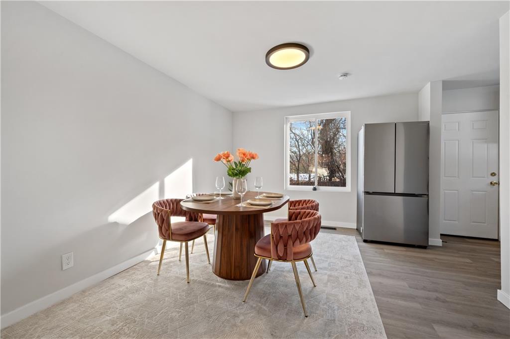 1486 Mill Street Pittsburgh, PA 15221 - Photo 9 of 25 a view of a dining room with furniture and wooden floor