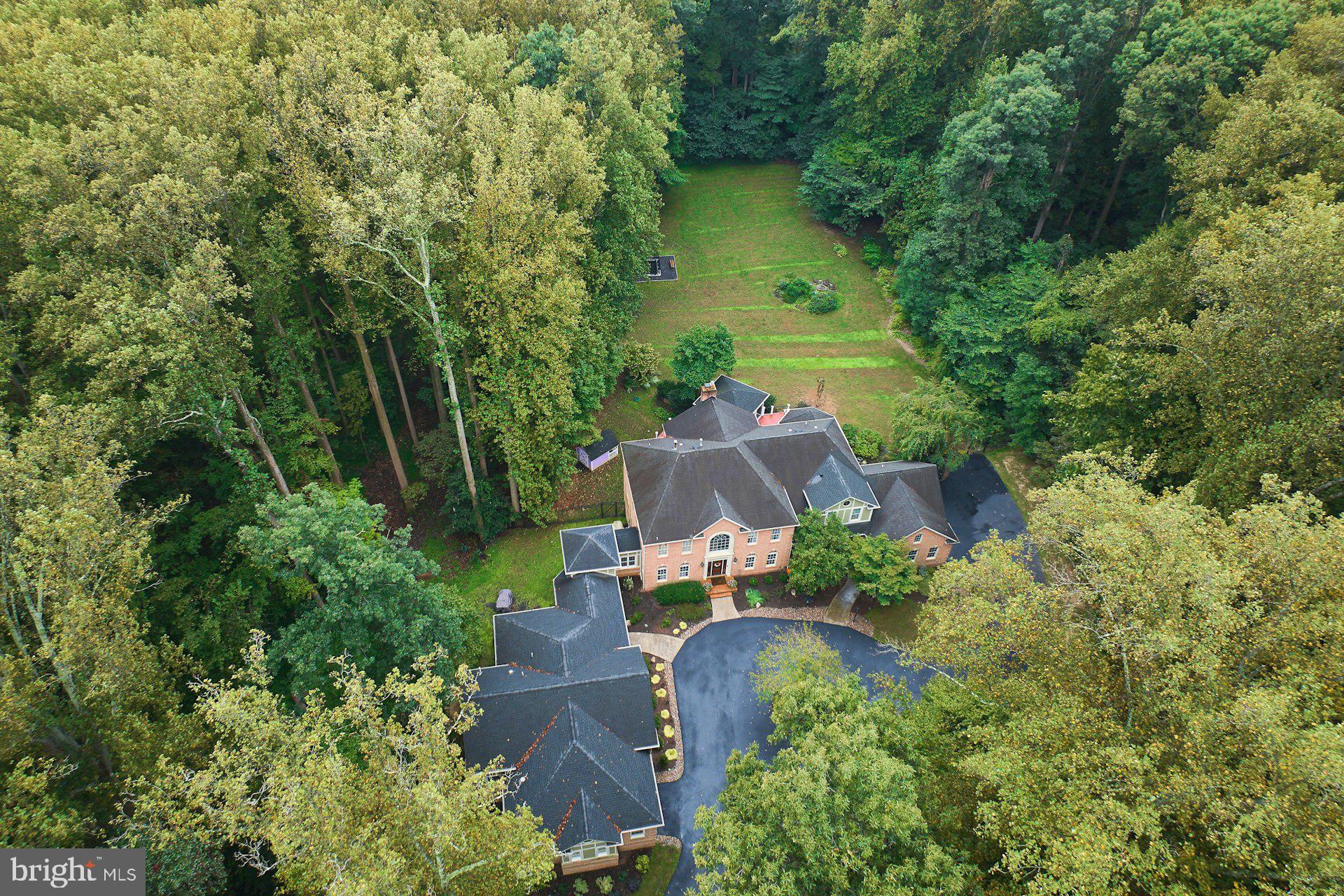 9113 Jeffery Road Great Falls, VA 22066 - Photo 12 of 31 an aerial view of a house with outdoor space and street view
