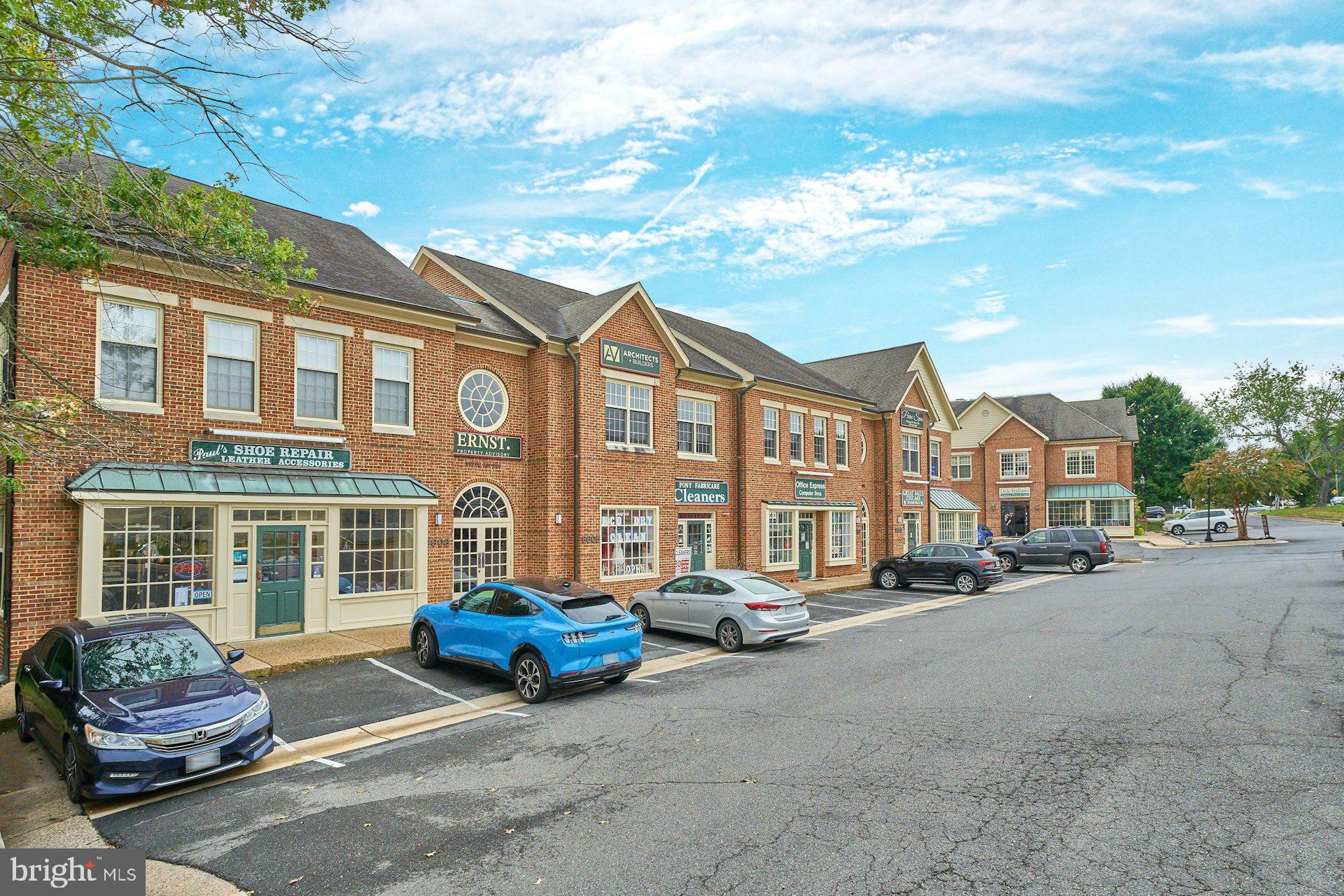 9113 Jeffery Road Great Falls, VA 22066 - Photo 23 of 31 a car parked in front of a brick building