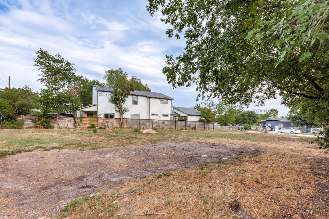 6806 Cruz Street Austin, TX 78741 - Photo 7 of 9 a front view of a house with a yard and trees