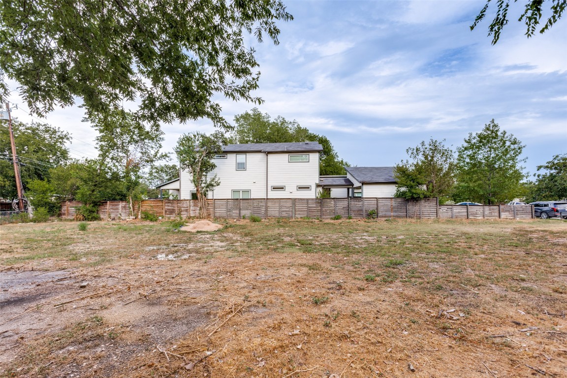 6806 Cruz Street Austin, TX 78741 - Photo 8 of 9 a view of a house with backyard and a tree