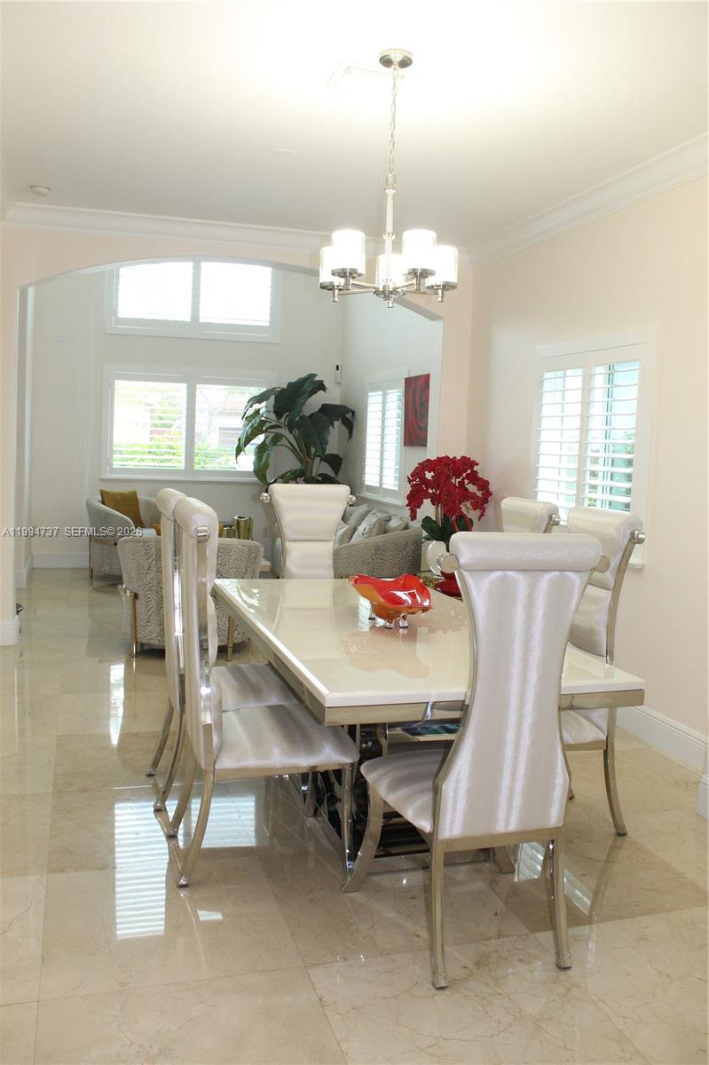 15580 Southwest 176th Terrace Miami, FL 33187 - Photo 3 of 32 a view of a dining room with furniture window and outside view