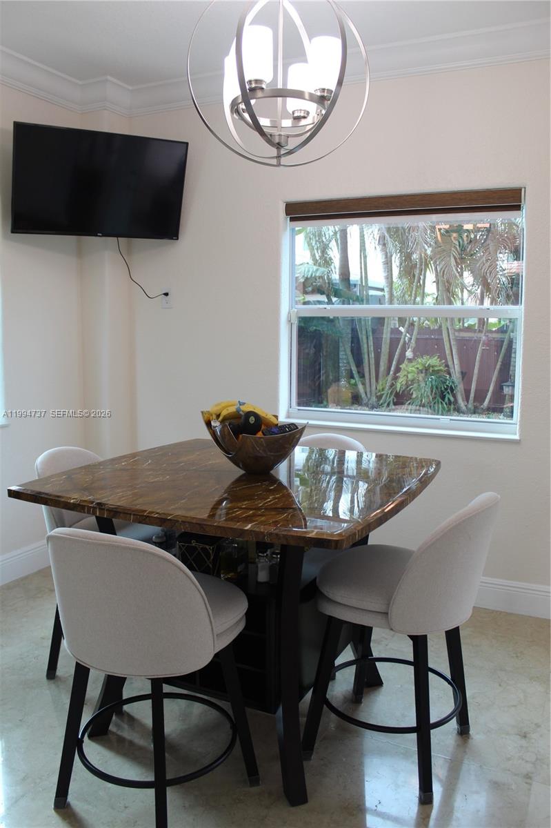 15580 Southwest 176th Terrace Miami, FL 33187 - Photo 4 of 32 a view of a dining room with furniture window and outside view