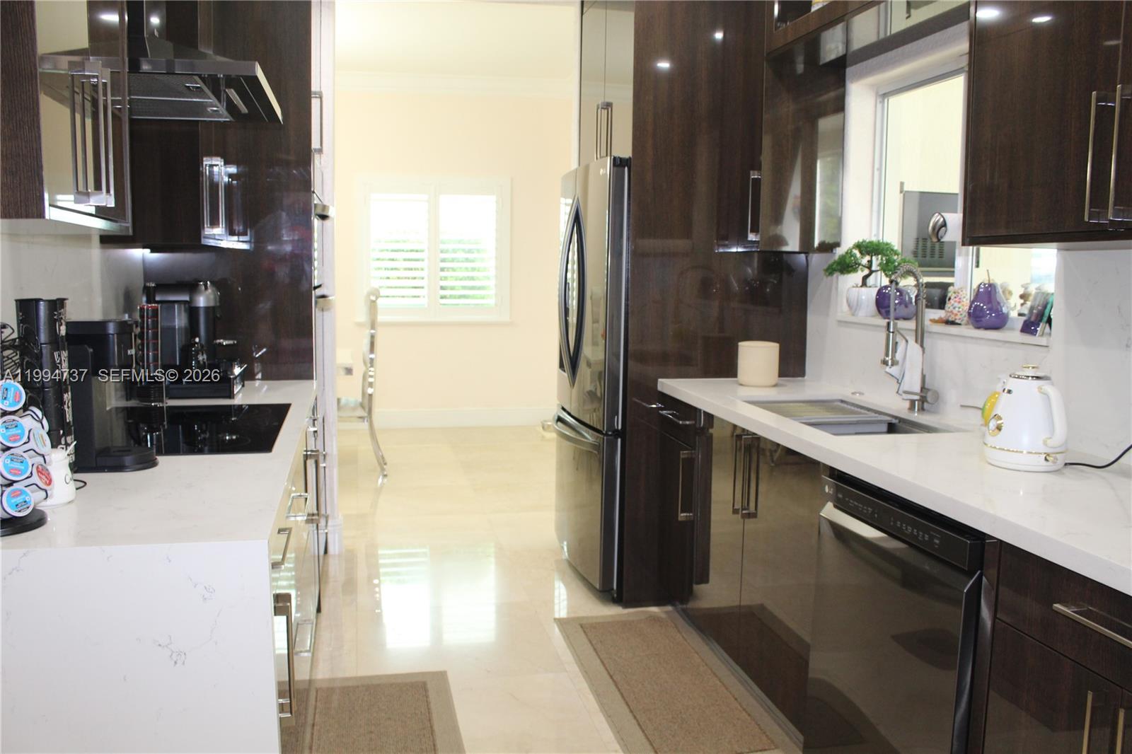 15580 Southwest 176th Terrace Miami, FL 33187 - Photo 6 of 32 a bathroom with a sink double vanity and a mirror