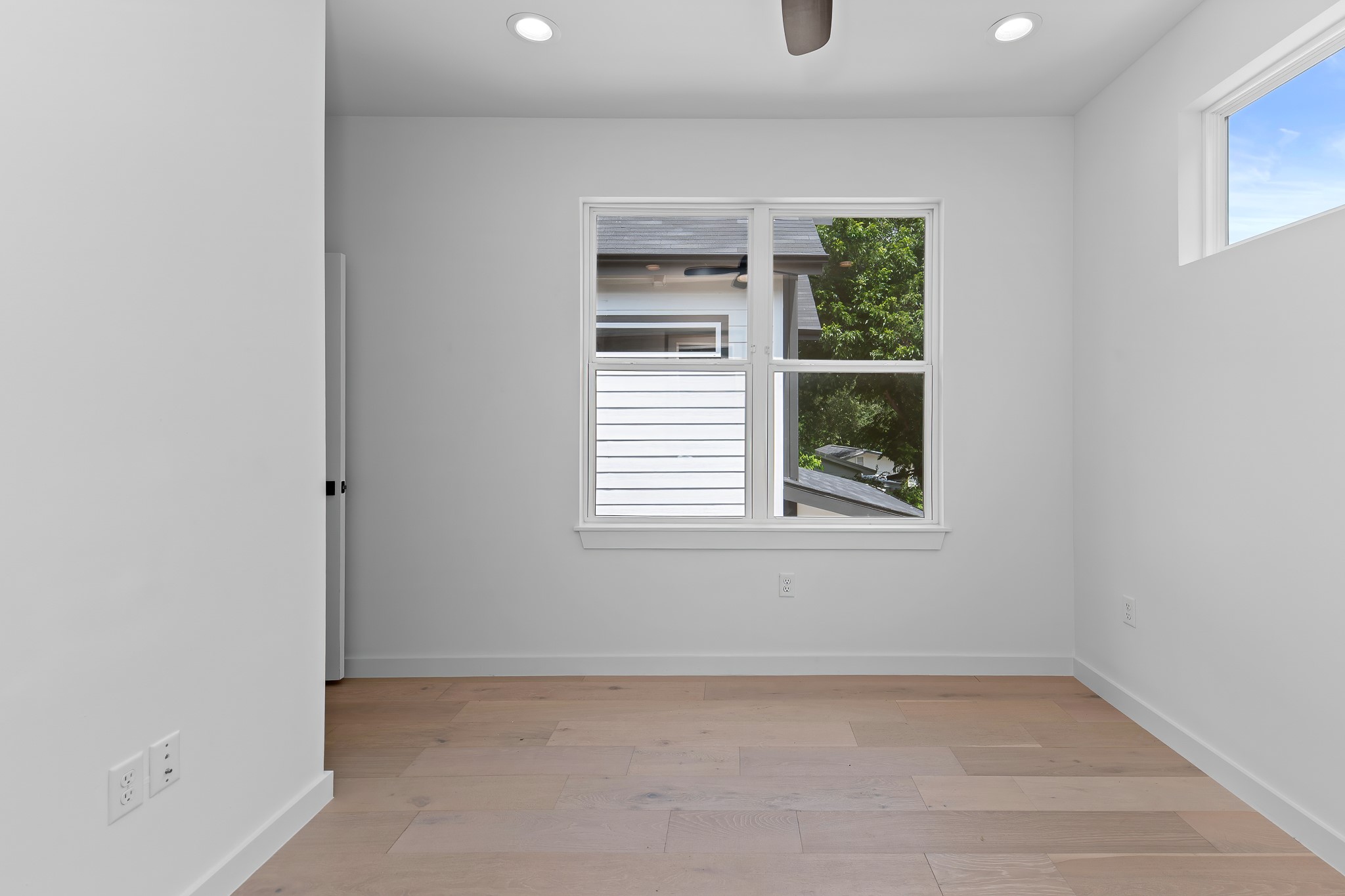 5305 Ledesma Road, Unit 4 Austin, TX 78721 - Photo 29 of 40 Hardwood floors and generous window lighting create an airy, neutral space ready for your personal touch.