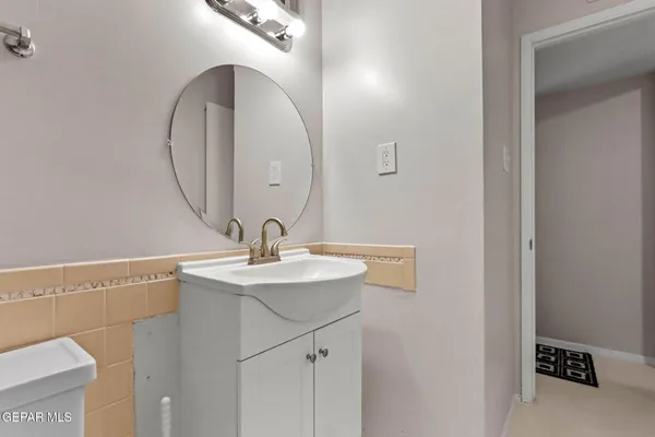 a bathroom with a sink and mirror