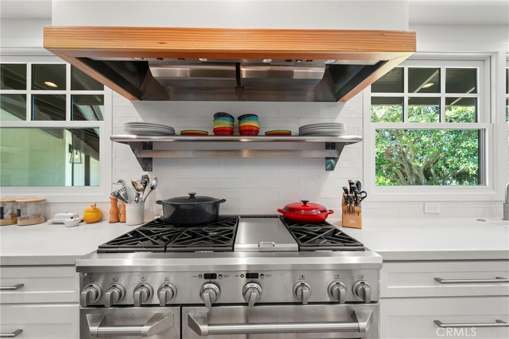 7337 La Soldadera Rancho Santa Fe, CA 92067 - Photo 6 of 60 a stove top oven sitting inside of a kitchen
