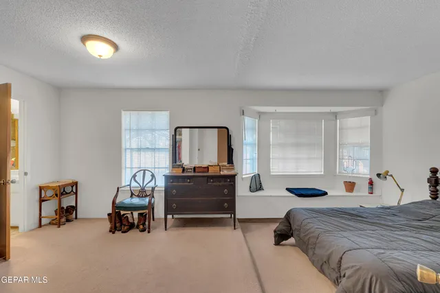 a bedroom with furniture and a bed