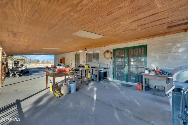 a living room with lots of furniture and a table