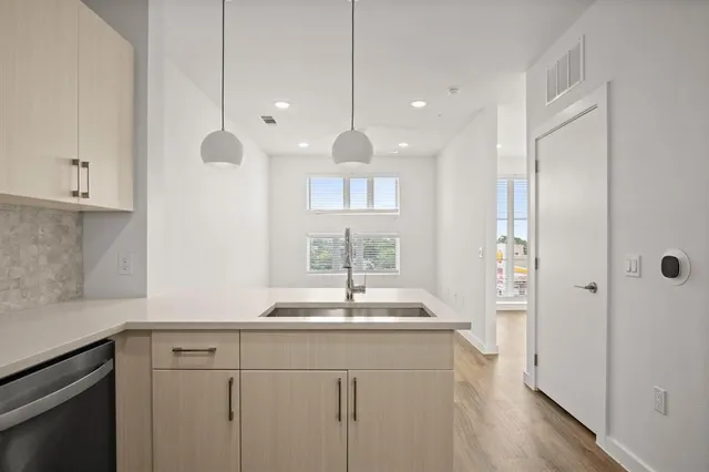 a view of kitchen with wooden floor and window